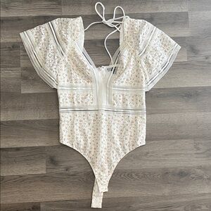 NWOT Flutter sleeve floral print bodysuit.